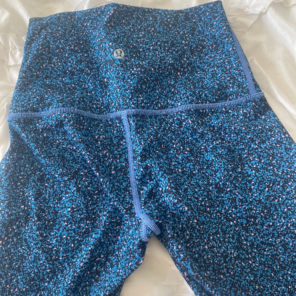 comfy lululemon leggings in great conditon, a mix of royal blue, pink, and black